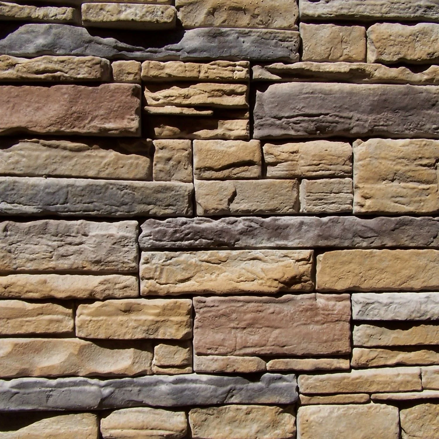 Stone masonry veneering on home exterior