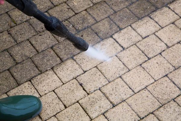 Pressure washing a paver surface